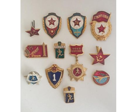 Group of (12) Soviet Armed Forces Excellence badges, to include original, obsolete and vintage examples. Shipping Group (A). 