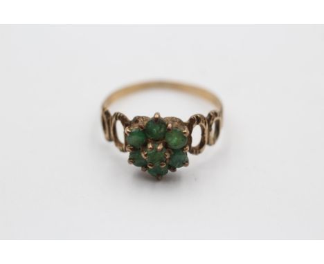 9ct gold emerald floral cluster ring featuring openwork shank. Size: Q, Weight: 1.7g. Shipping Group (A). 