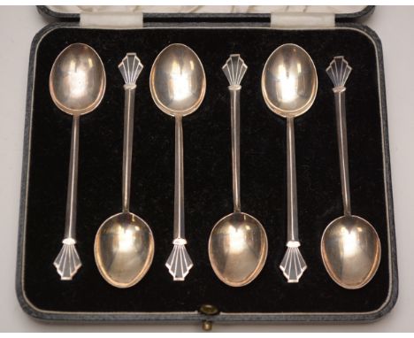 A set of six silver and black enamel Art Deco coffee spoons, by William Hair Haseler, Birmingham, 1934, with fan decorated fi