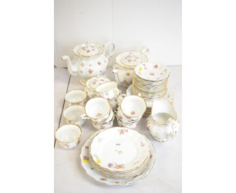 An early 20th Century Continental porcelain tea service, each piece printed with colourful flowers, sprays and sprigs, compri