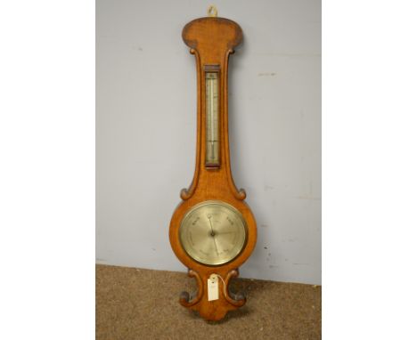 Negretti &amp; Zambra oak cased wheel barometer, the silver circular dial and thermometer contained within an oak case with s