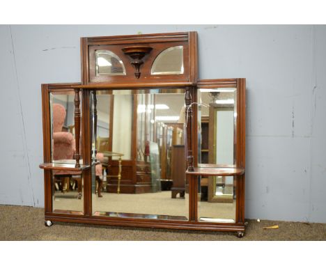 A mid 20th Century mahogany three-plate wall mirror, the central bevelled mirror plate flanked by two subsidiary plates, ring