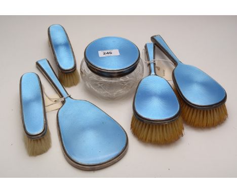 A silver-mounted blue guilloche enamel decorated dressing table set, by William Comyns &amp; Sons, London, 1937, comprising: 