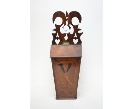 A late 18th/early 19th Century inlaid mahogany candle box, the pierced back above hinged cover and inlaid knife and fork desi