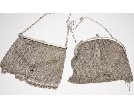 A silver chainmail purse, of typical design with tassel decoration; together with a white metal chainmail purse, with bluesto