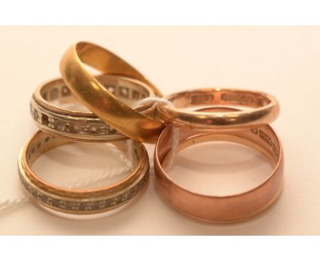 A selection of wedding and eternity rings, to include: 22ct yellow gold wedding band, 2.8g; a paste set eternity ring stamped