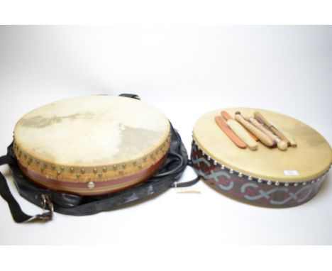 An Irish Bodhran signed by Doug Lanchbery, with Celtic decoration; another baring label of Tyneside Irish Festival 1987; toge