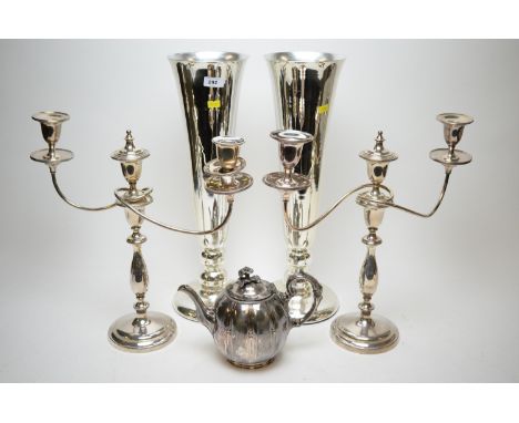 A pair of aluminium trumpet-shaped vases; a pair of electroplate two-branch candelabra; and a Britannia metal teapot and cove