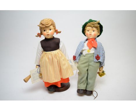 A pair of Hummel limited edition porcelain and fabric figures 'Birthday Serenade', HM218/DA and HM 218/DA dated 1983, 42cms h