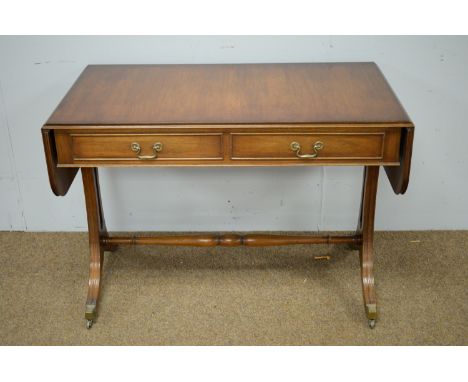 Reprodux: a Regency style mahogany sofa table, with two frieze drawers opposed by two false drawers, downswept supports with 