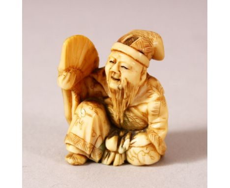 A JAPANESE MEIJI PERIOD CARVED IVORY NETSUKE - SEATED MAN - carved depicting a seated scholar or sage holding his fan - 3cm