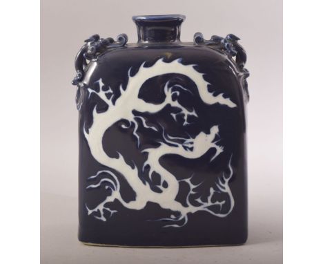 A CHINESE MING STYLE PORCELAIN SQUARE FORMED DRAGON WATER POT - decorated with dragon and clouds - the shoulder with moulded 