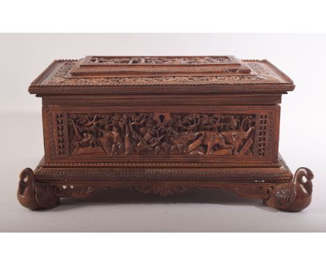 A FINE ANGLO INDIAN CARVED SANDALWOOD BOX, beautifully carved with scenes of animals and figures in a forest including tigers
