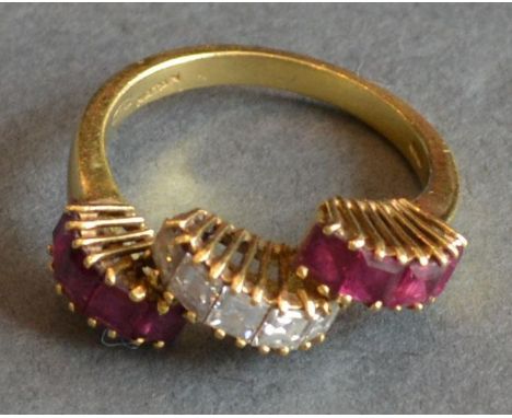 An 18ct. Gold, Ruby and Diamond Ring of Triple Band Fan Form, 4.9 gms all in 