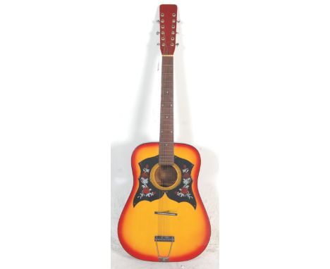 A vintage Korean made six string acoustic guitar having a sunburst finish body with dual scratch board and a red finished bac