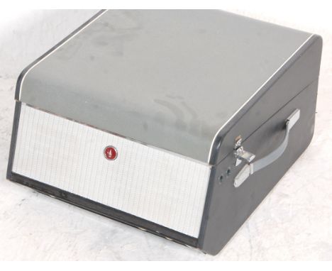 2. A retro mid-century two-tone colourway portable record player by Bush having an inset Garrard deck. Complete with original
