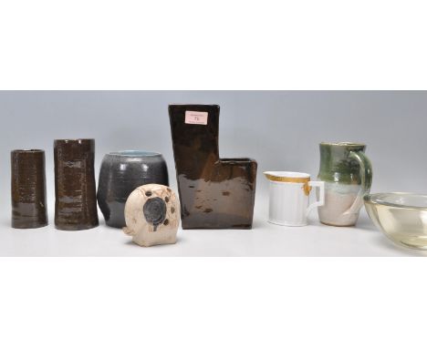 A mixed group of Studio Art pottery ceramics with a brown glazed L shaped vase with two sections bearing Ls mark to base, two