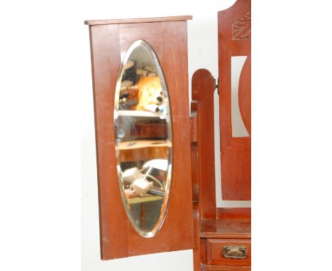 A 19th Century Victorian mahogany dressing table chest of drawers having a tri fold mirror top with self and twin drawers, th