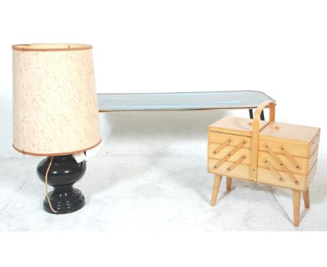 A collection of vintage mid 20th Century retro items to include a teak wood coffee / side table raised on tapering legs, a be