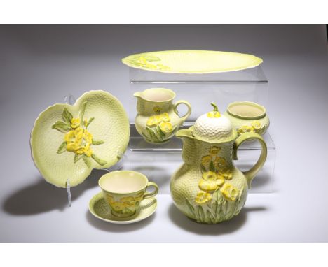 A CARLTON WARE COFFEE SERVICE, each piece moulded and painted with floral sprays against a shaded green dimpled ground, compr