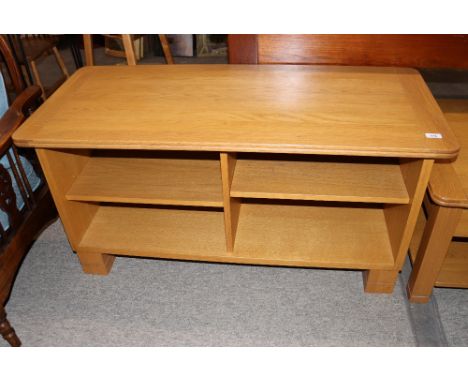 An Ercol television and music stand, 117cm wide x 51cm deep x 58cm high