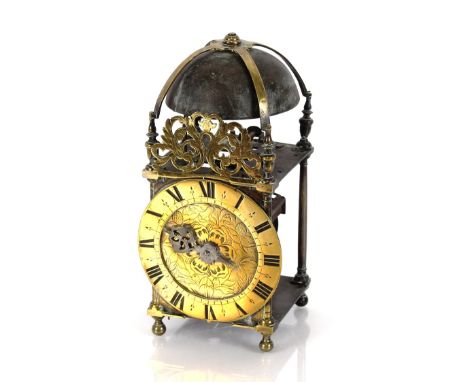 A 17th Century brass and steel cased lantern clock, 32cm high