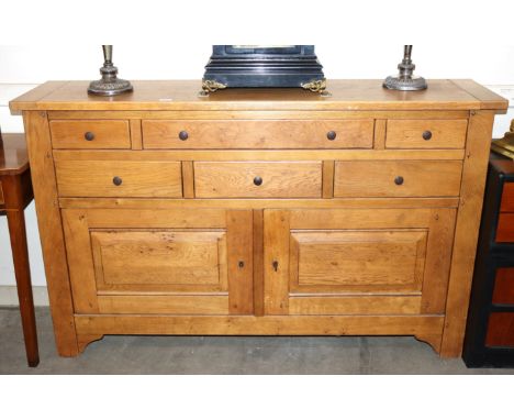 A contemporary light elm sideboard fitted six drawers and cupboards under, raised on square section supports, 156cm wide&nbsp