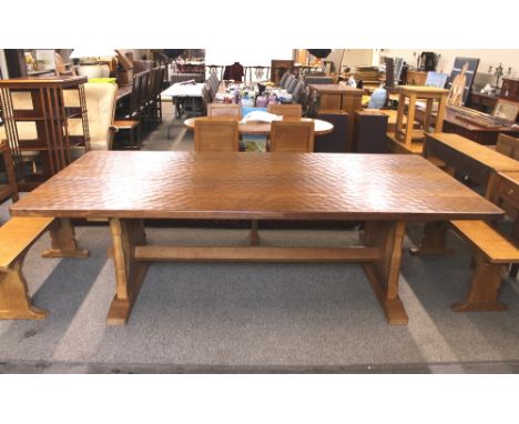 Workshop of Robert "Mouseman" Thompson of Kilburn, a large English oak refectory table, the adzed top raised on shaped end su