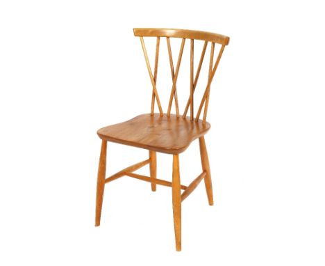 A set of four Ercol stick back kitchen chairs, raised on rounded supports united by H stretchers&nbsp;