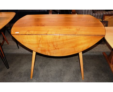 An Ercol drop leaf dining table, raised on tapering square section supports having rounded drop leaves, 112cm wide&nbsp;