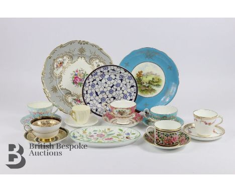 19th century Minton porcelain, including two cups and saucers; together with two large plates, painted with garlands of flowe