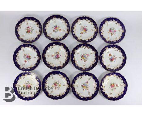 Twelve Spode 'Vintage' pattern plates, each plate hand painted with varying floral spray, with cobalt blue rim, approx 23 cms