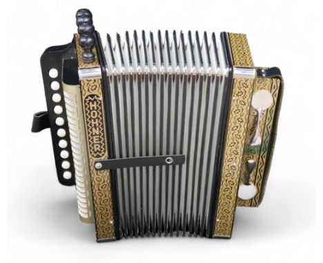 A Hohner 4 stop 10 button melodeon the four voice 14 bellows melodeon comes together with a wooden crate/case Condition Repor