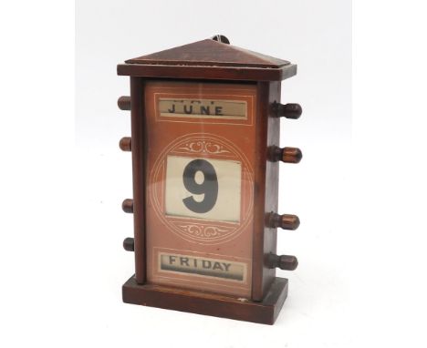 An early-20th century perpetual desk calendar, measuring approx. 22cm in height Condition Report:In generally good order, tho