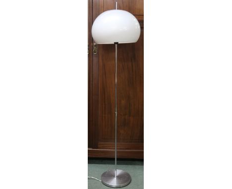 A 20th century after Guzzini standard lamp with domed acrylic shade on chromed upright with circular base, 147cm high&nbsp; C
