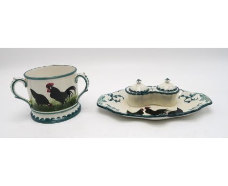 A Wemyss ware black cockerel and hens double inkwell 26cm wide, together with a tyg, 10cm high (2) Condition Report:inkwell -