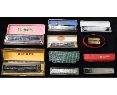 HOHNER a lot comprising various Hohner harmonicas to include a Chromonika 64, Echo Haro, Double Puck Harmonica, etc (8) Condi