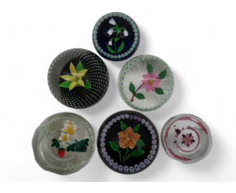 A collection of Caithness flower paperweights including Winter Flower, Rose, with 100 in number canes, no 179/250, Strawberry