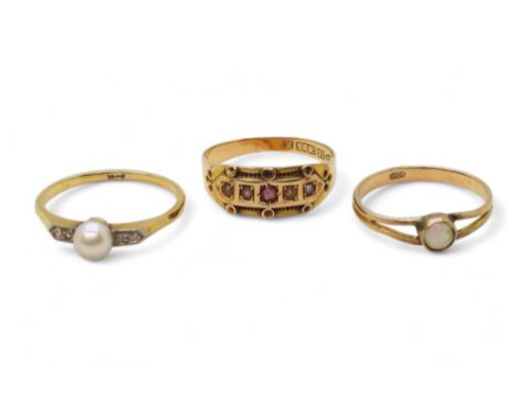 three gold rings, an 18ct gold pearl and diamond ring, size N1/2 1.9gms, 15ct pearl and red gem, size O1/2 weight 2gms and a 
