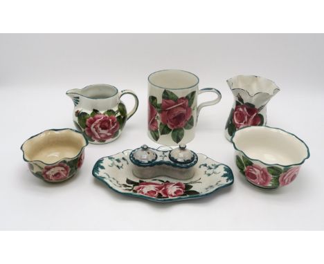 A collection of Wemyss ware all painted with cabbage roses including a tankard 14cm high, a wavy rim vase, two graduated wavy