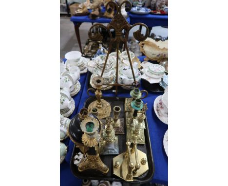 A collection of cast brass and metal candlesticks, a lamp and a pair of bookends, together with an easel frame Condition Repo