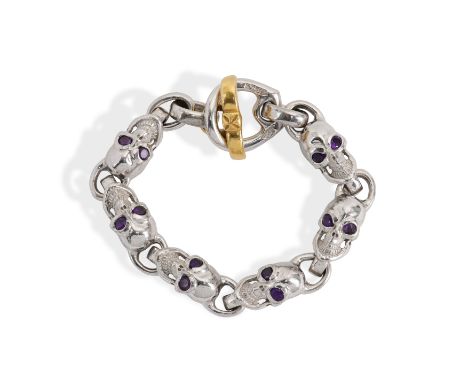 A custom Bill Wall Leather (Malibu) 18ct yellow gold, silver and amethyst skull bracelet. The stylised bracelet having six si