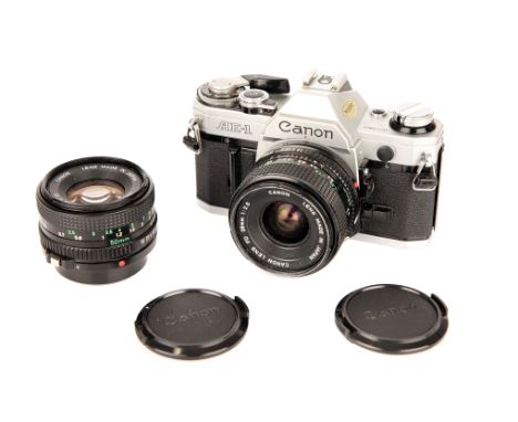 A Canon AE-1 SLR Camera, with FD f/2.8 28mm and FD f/1.8 50mm lenses (a lot)