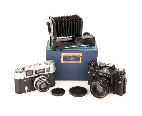 A FED 4 Rangefinder Camera, together with Zenit TTL and FED Bellows (a lot)