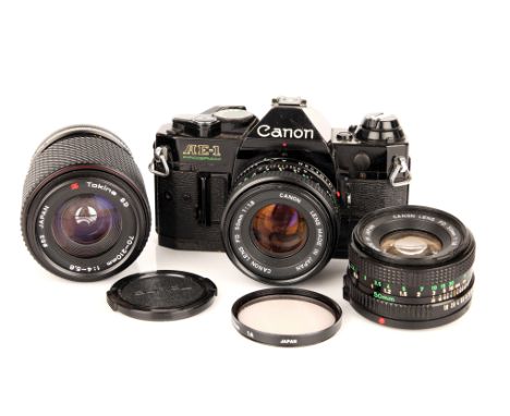 A Canon AE-1 Program SLR Camera, with two FD f/1.8 50mm and a Tokina f/4-5.6 70-210mm lenses (a lot)