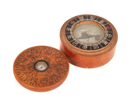 A Chinese Geomancers Compass, turned wooden body with chinese charicters to the top, glass window with compass needle to cent