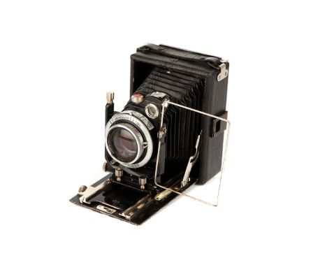 An Unmarked Folding Camera, black, with Ross Xpres f/3.8 105mm lens, chrome, serial no. 265301, body, G, lacking ground glass