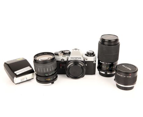 An Olympus OM10 SLR Camera, complete with various lenses and accessories (a lot)
