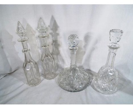 Four heavy good quality decanter with stoppers