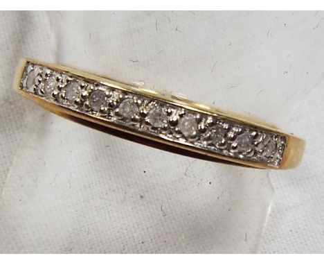 A lady's 9 carat gold 10 pt diamond set half eternity ring, approx weight 2.9 gm, size K + 1/2 - Est £40 - £50
